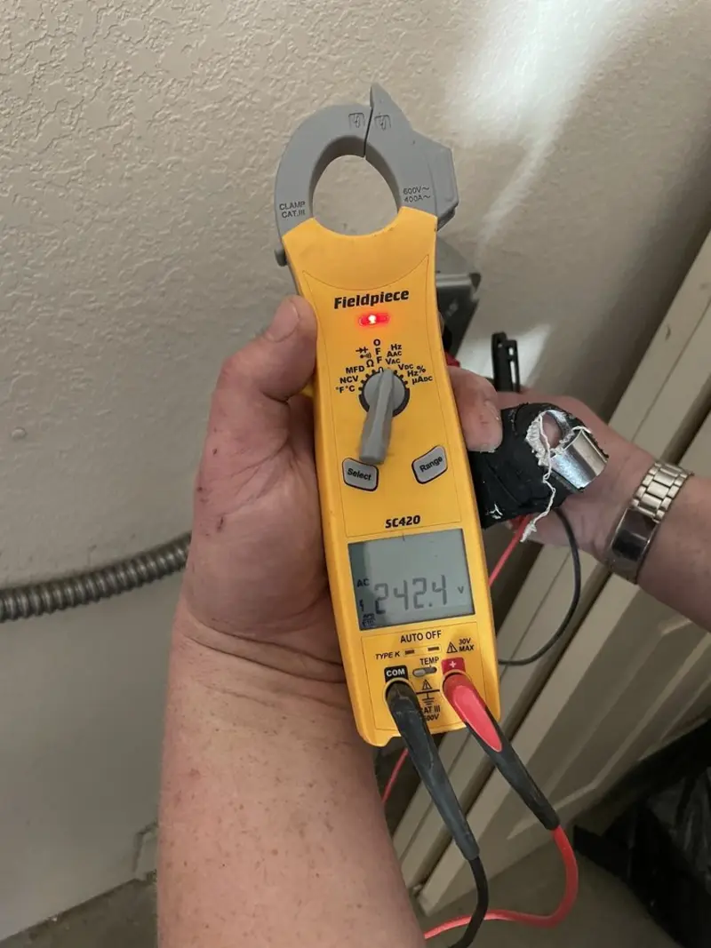 Voltage testing with clamp meter during Recessed Lighting Installation in Red Rock